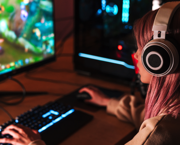 A woman games on her computer.
