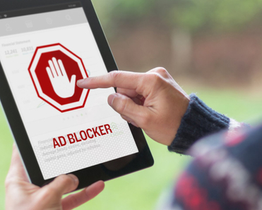 Man turning on ad blocker on his iPad