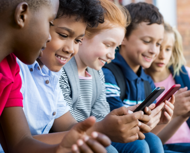A group of kids watch videos on their iPhones.