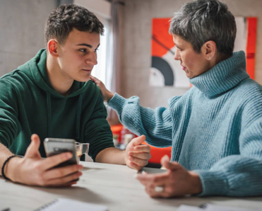Teenage boy and mom having a discussion.