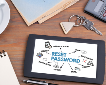 Reset Password. Text on tablet device on a wooden table
