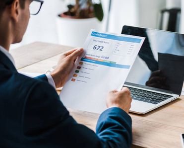 A man reads a credit report.