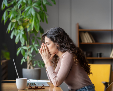 Woman looking at laptop