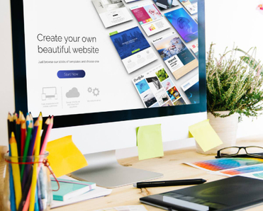 Web builder concept: A computer with the text &quot;Create your own beautiful website&quot;