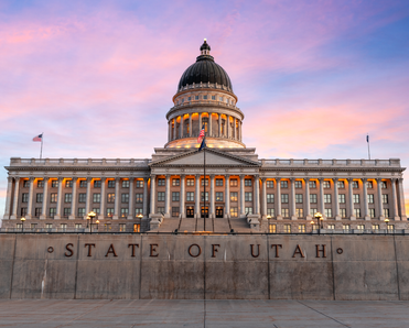 The front of the State of Utah capital building at sunset.