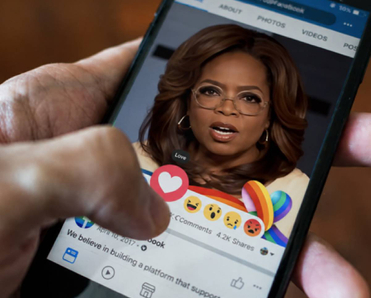Oprah ad on Facebook with person hitting love heart icon