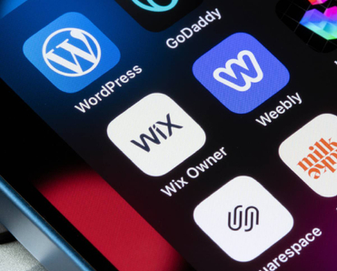Assorted website builder apps on smartphone