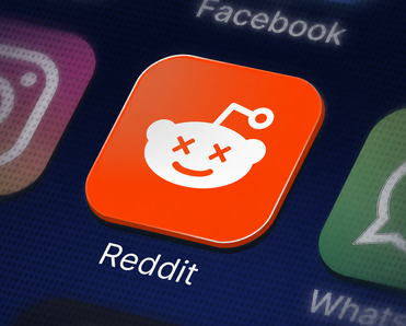 The Reddit app icon with Xs over the eyes.