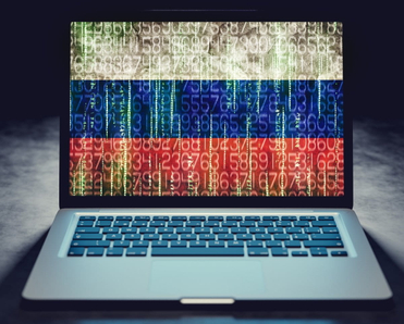 Hacked laptop screen with Russian flag.