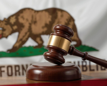 A gavel before the Californian flag.