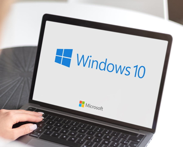 Notebook with Microsoft Windows 10 logo.