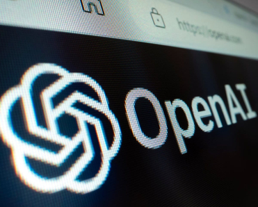 Close-up view of OpenAI logo on its website.