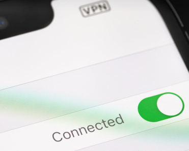 Apple iPhone with VPN settings on screen.