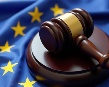 A gavel atop a European Union flag symbolizing EU law and justice