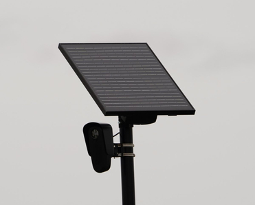 Flock safety police law enforcement license plate reader set up outside to help catch vehicle speeders.