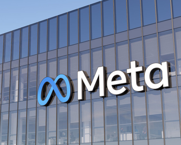 Meta logo on side of glass office building.