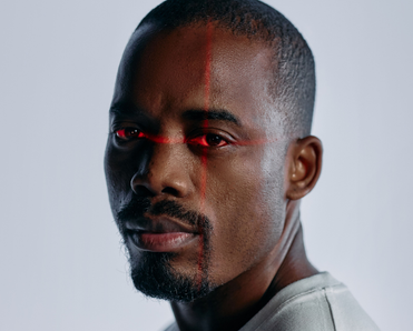 Close up of a man with a laser scan over his eyes.