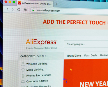 Aliexpress.com website homepage on Apple iMac monitor screen.