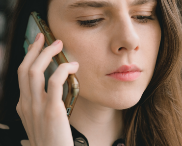 Woman engaged in a phone conversation.