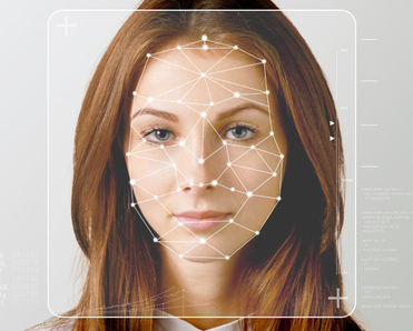 Serious business woman and smart technology for face recognition.