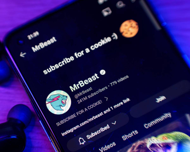 Closeup of smartphone with subscribe page for MrBeast