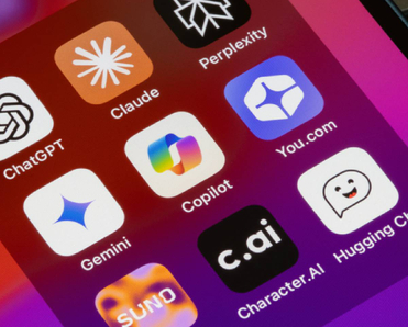 Assorted AI apps are seen on an iPhone, including ChatGPT, Claude, Perplexity, Gemini, Microsoft Copilot, You.com, Suno, Character.AI, and Hugging Chat