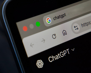 ChatGPT website open on laptop.