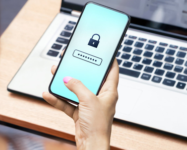 Woman inputting password on her phone.