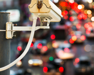 Back view of CCTV camera recording traffic.