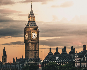 Moody picture of UK parliament at sunset.