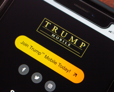 Smartphone screen displaying Trump Mobile’s call-to-action website page with yellow “Join Today” button and social media icons.