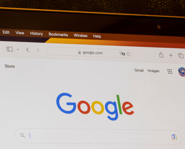 Google's website homepage is seen on a MacBook Air laptop.
