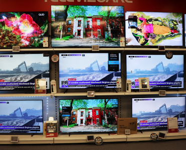 Shelves full of LED TVs in a store.