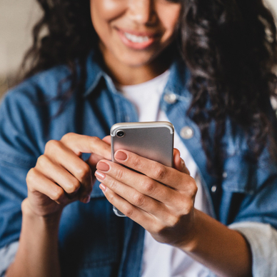 woman tapping on her phone