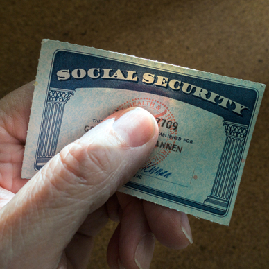 Hand holding a Social Security card