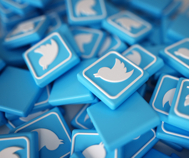 A pile of blue and white Twitter logo chips; Elon Musk plans to charge Twitter users a subscription fee for the verification checkmark on their profile. Here&#x27;s how U.S. adults feel about it.