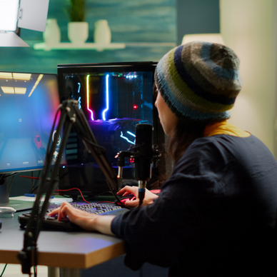 A woman streams on Twitch while playing FPS games and chatting with her subscribers in the chat.
