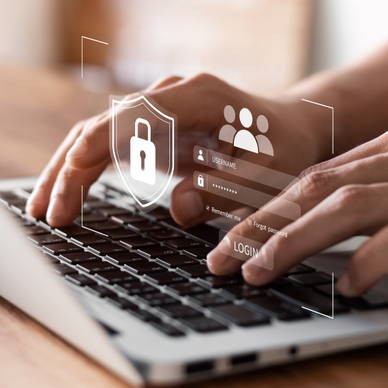 Hands typing on laptop keyboard with hovering lock and login above it