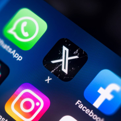 Close-up of a smart phone screen with a focus on the X (formely Twitter) app icon.