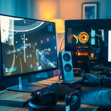 A close up of a gamer playing a video game on a gamer PC desktop 