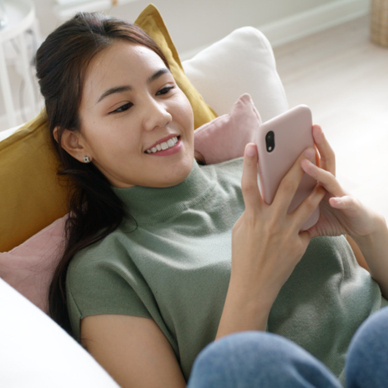 Girl smiling at phone