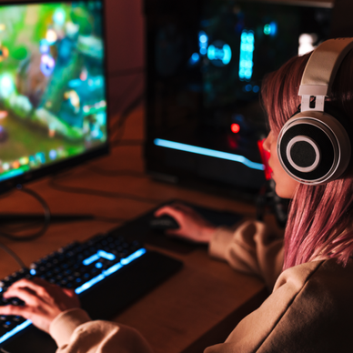 A woman games on her computer.
