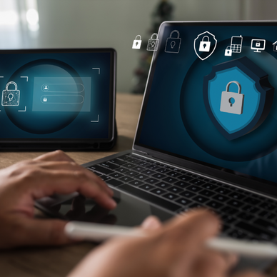 Antivirus alert is shown on a tablet and laptop.