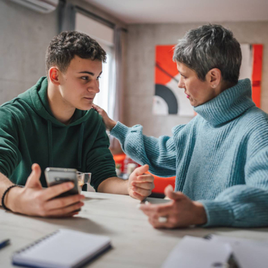Teenage boy and mom having a discussion.