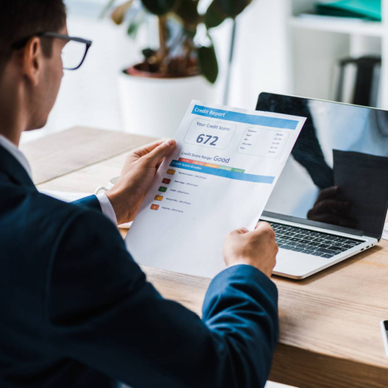 A man reads a credit report.