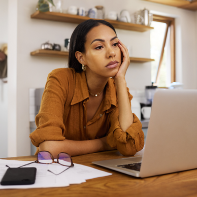 Woman looking sad at laptop