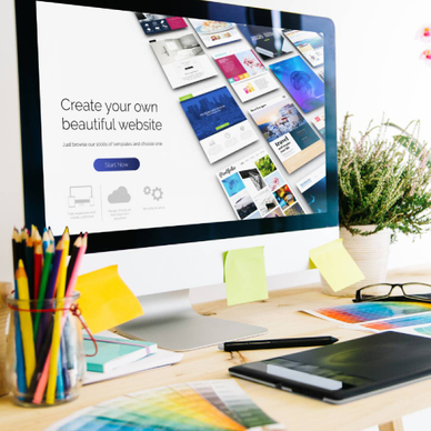 Web builder concept: A computer with the text &quot;Create your own beautiful website&quot;