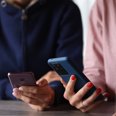 Two Android users holding their phones