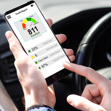 A closeup of a person checking their credit on a mobile credit monitoring app