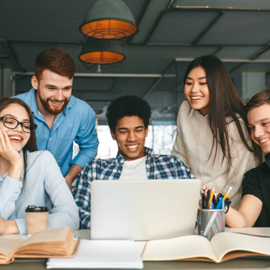 Five diverse teens centered around a school-issued laptop